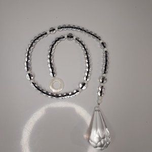 Vtg Black and white glass bead Sunchaser with 2" crystal drop